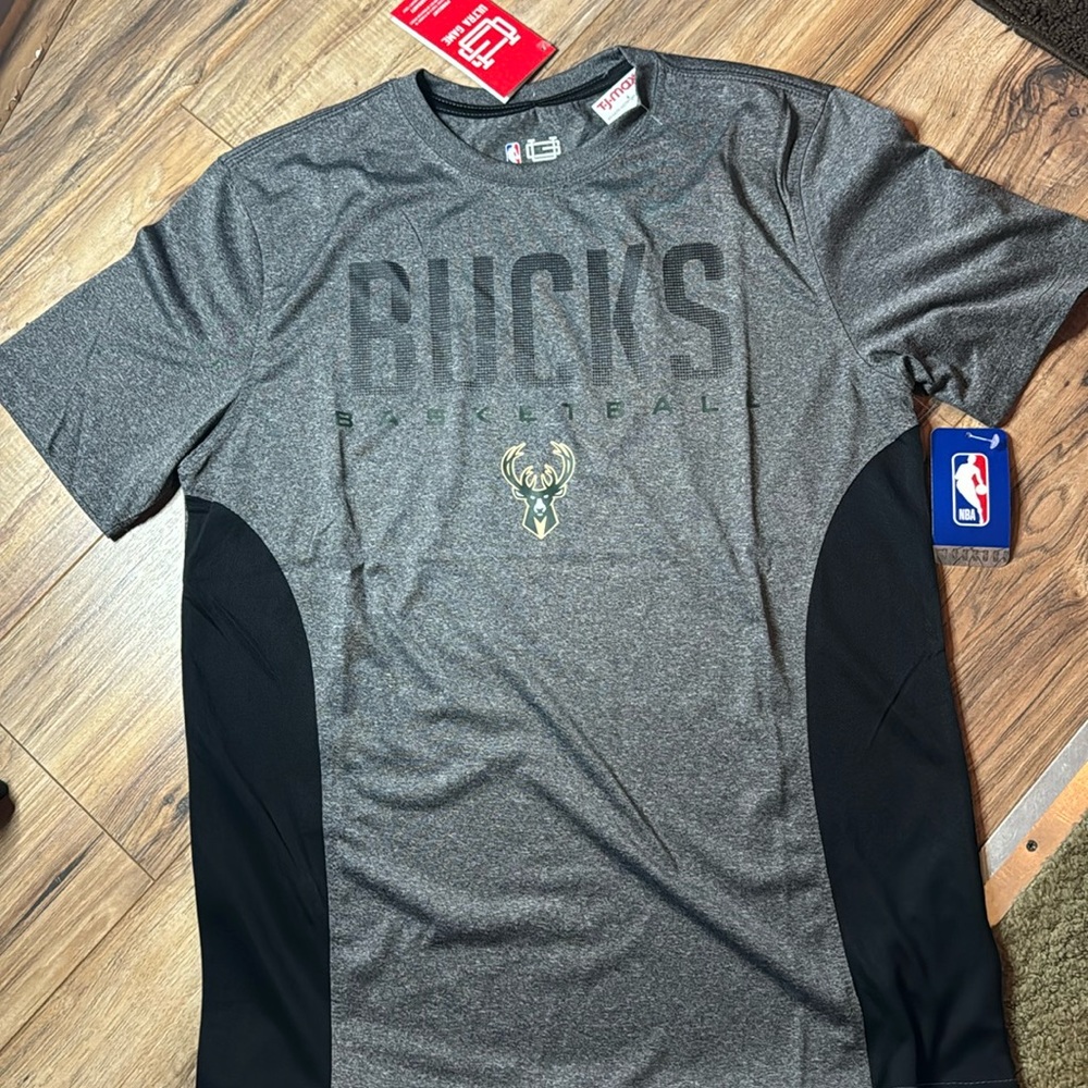 New with tags, Milwaukee Bucks t shirt. Size medium